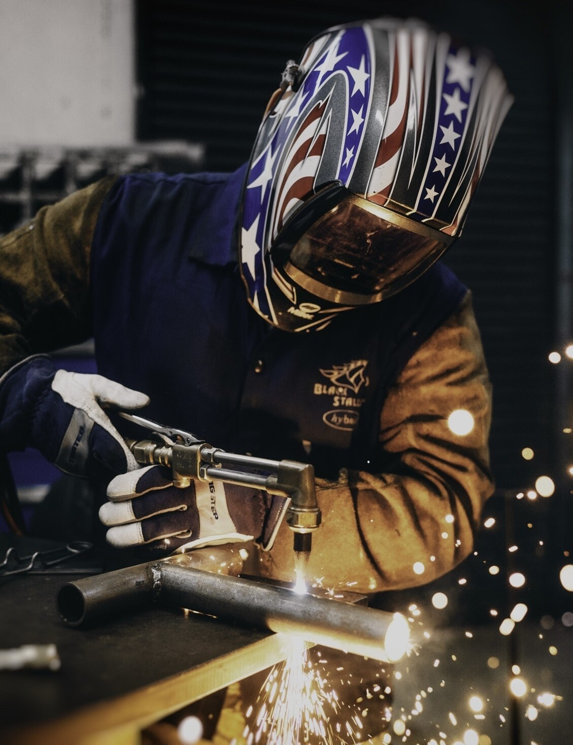 Person welding with safety gear on at Advanced Welding Institute
